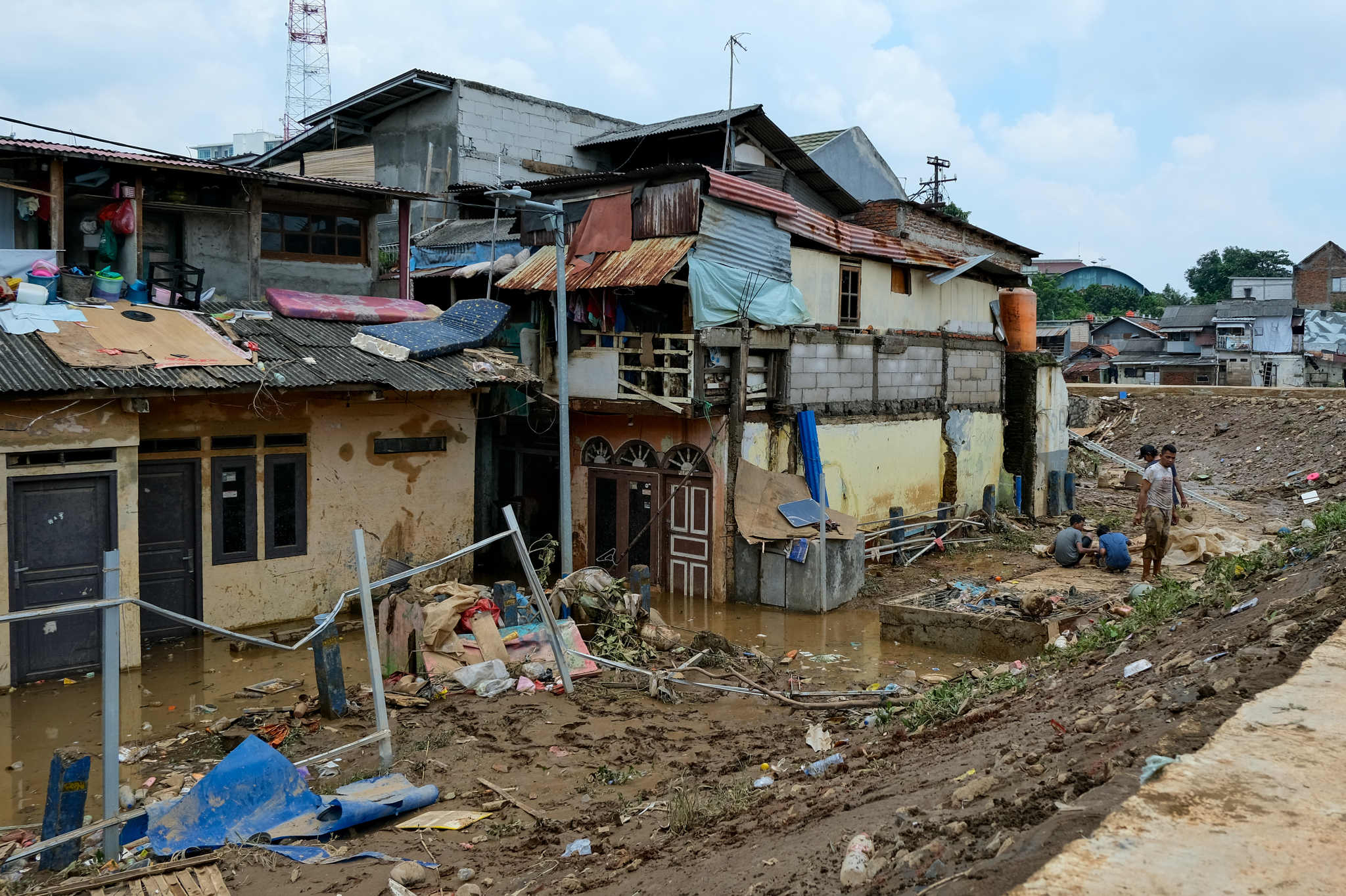 Floods Inundate Jakarta After Cuts to Disaster Relief
