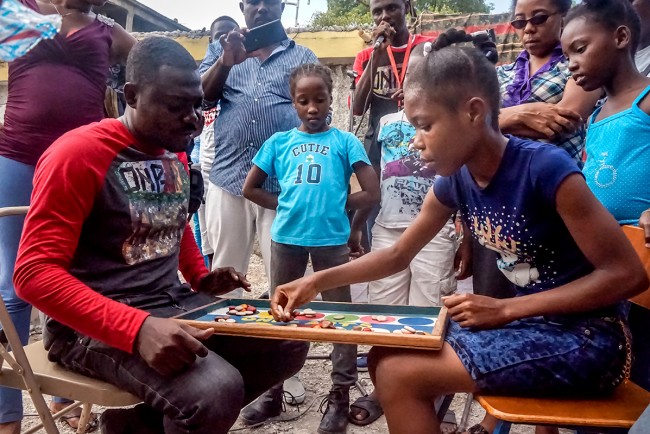In Haiti, Caravan Tours Seek to Revive Traditional Games in the Digital Age